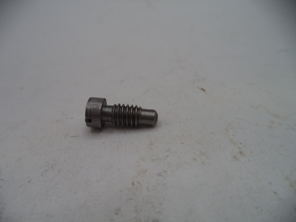 Metal screw on a light gray surface