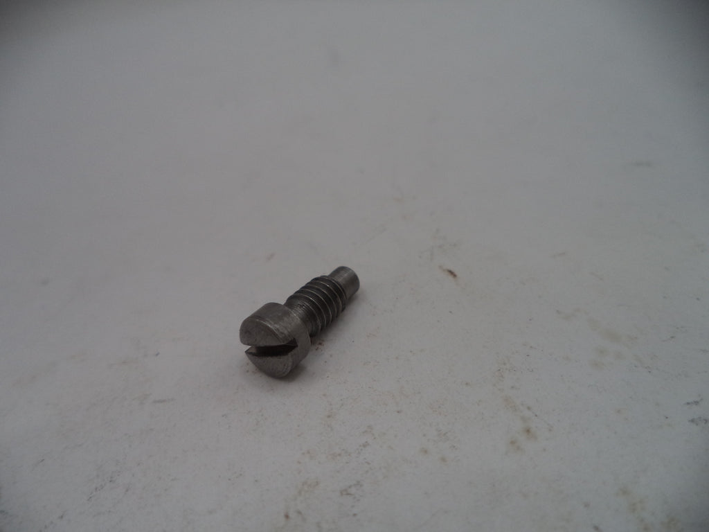 Metal screw on a light gray surface