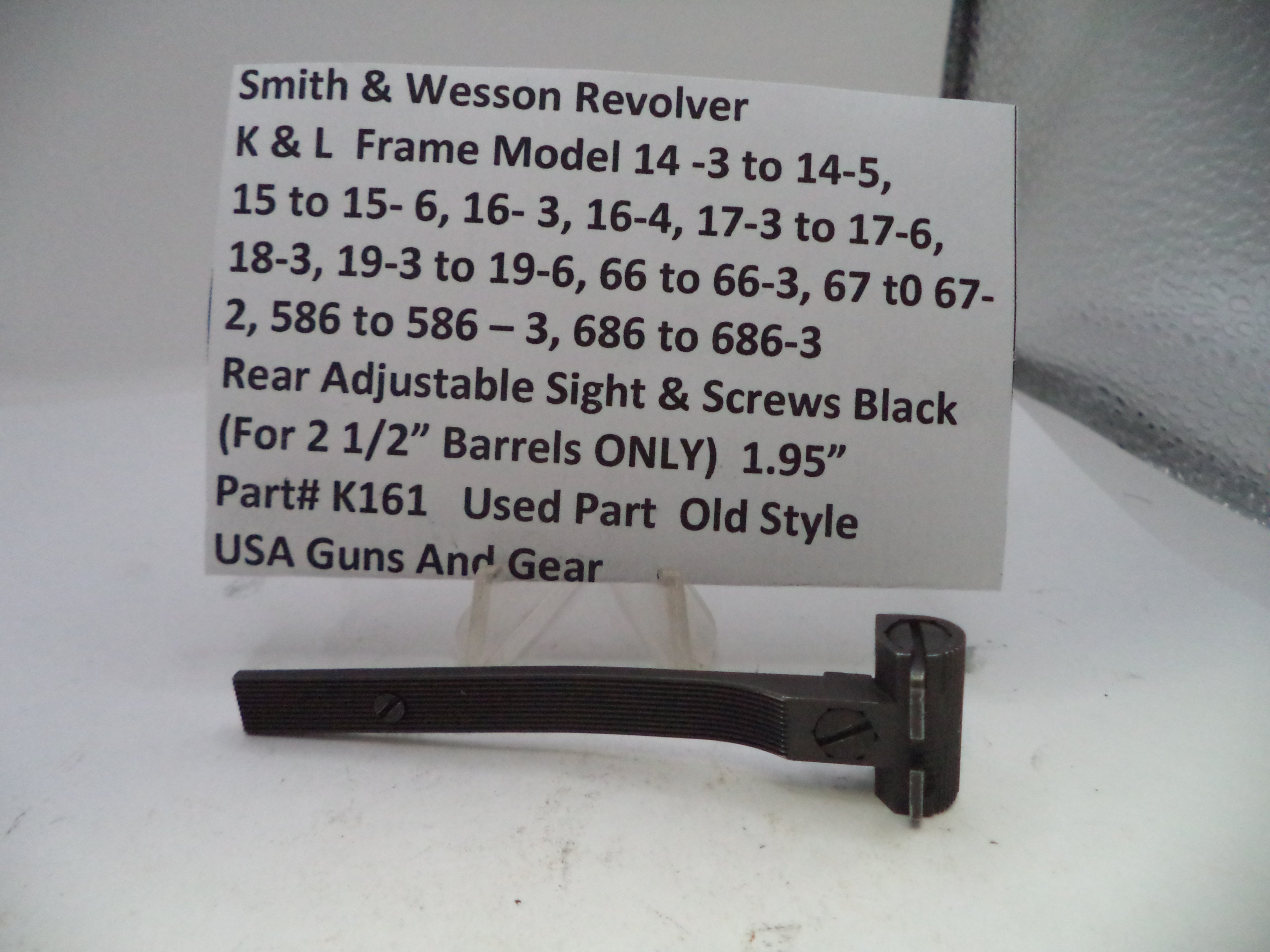Smith & Wesson revolver part with descriptive label on a white background