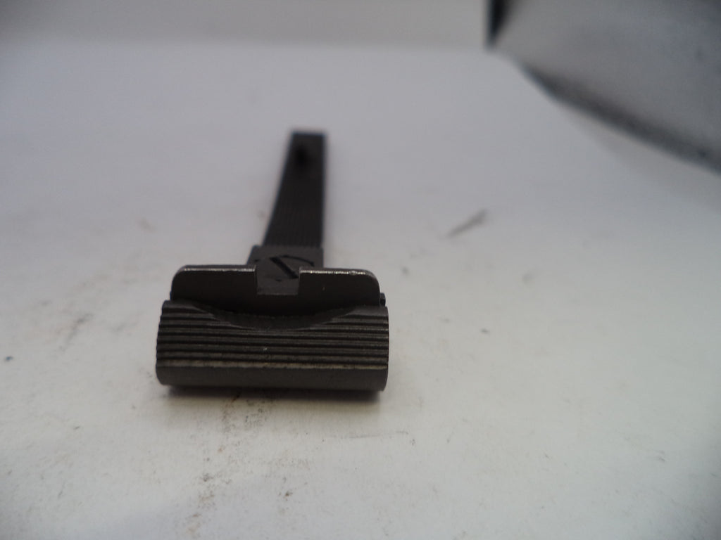 Black metal tool on a white surface