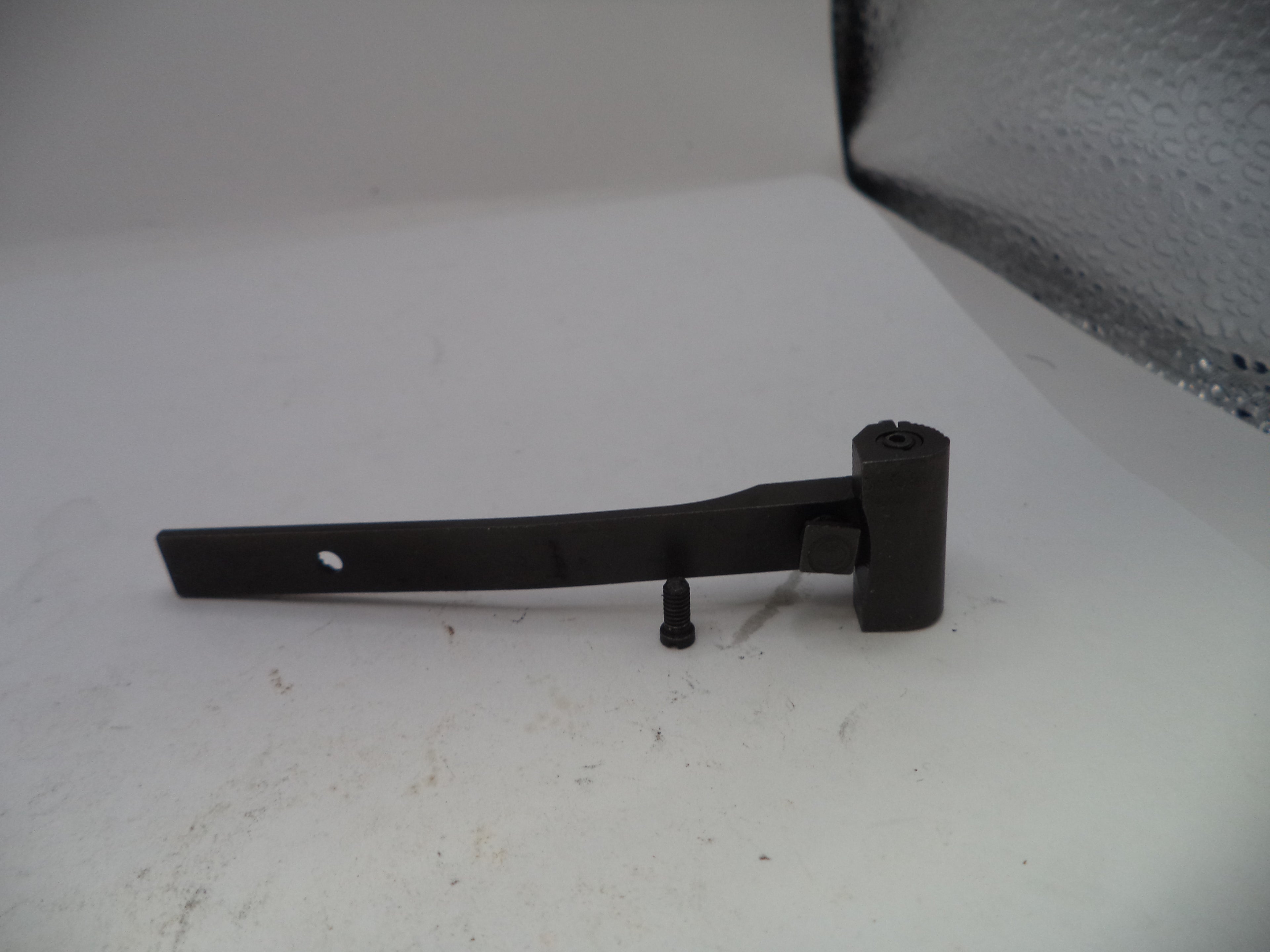 Black metal bracket on a white surface