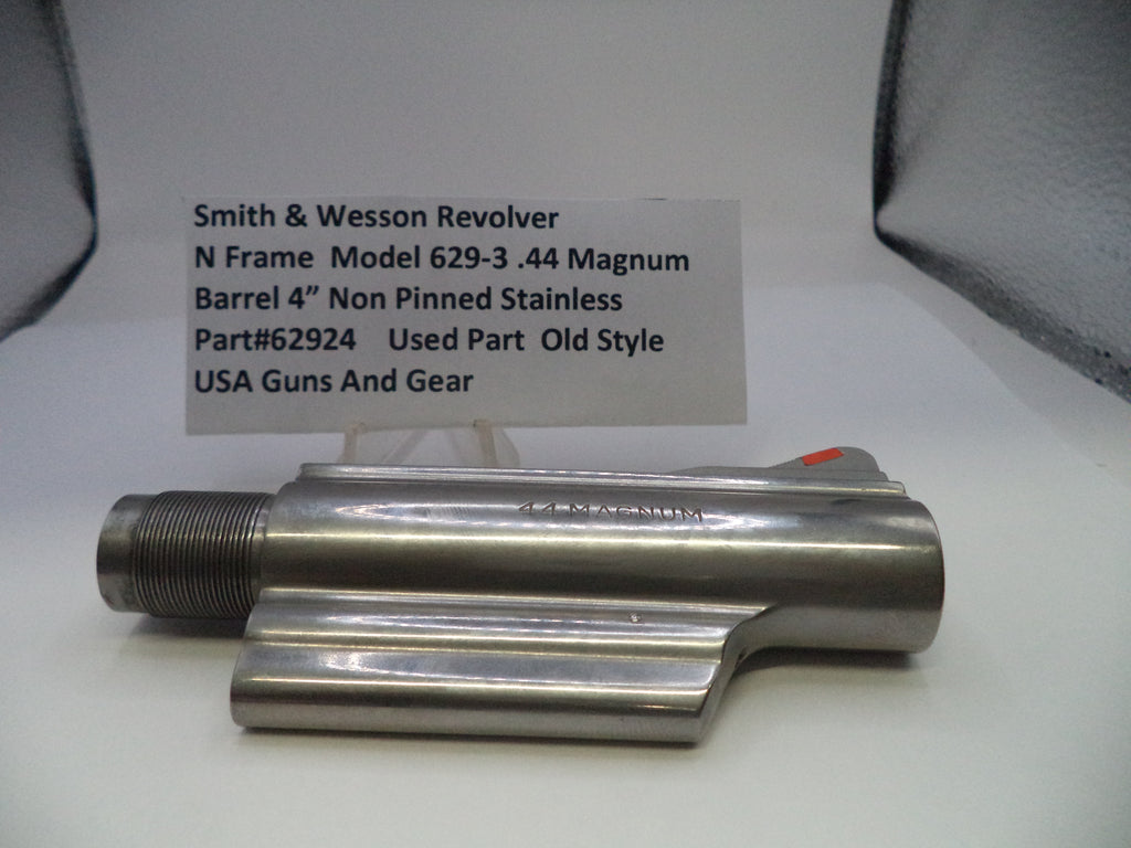 Smith & Wesson revolver barrel on a white surface with a label