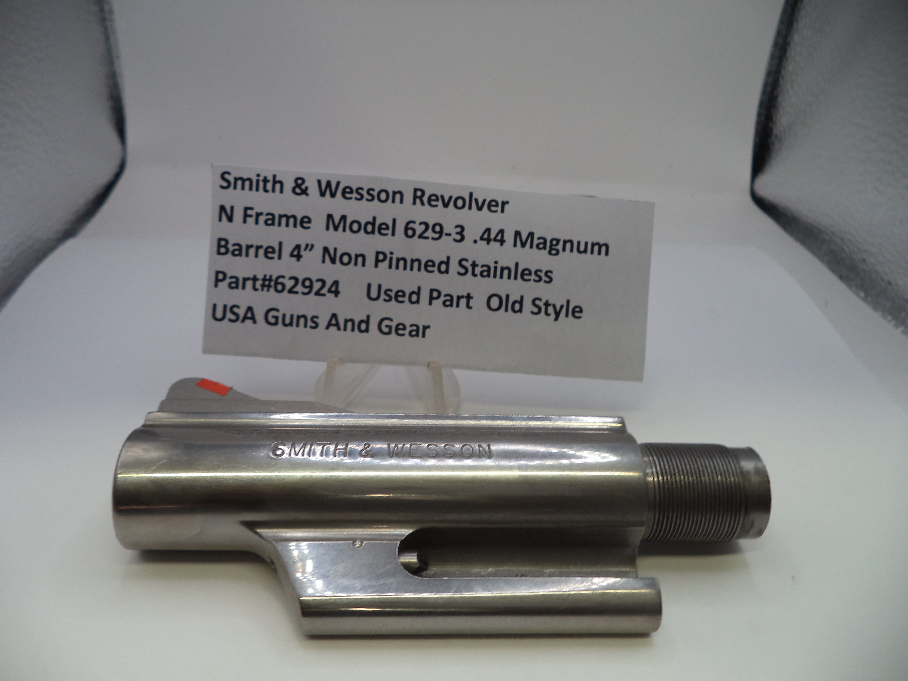 Smith & Wesson revolver barrel on a white background with a label
