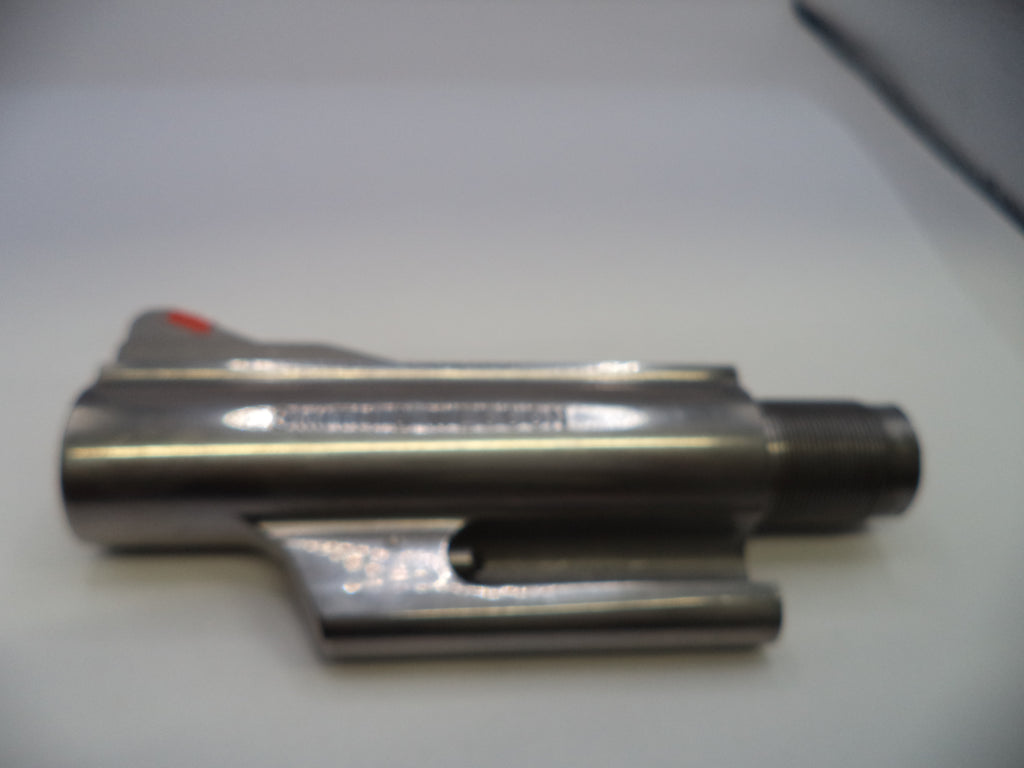 Metallic object on a white surface