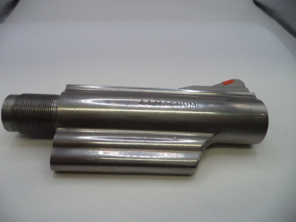Metal cylindrical component with '14 Magnum' marking on a white surface