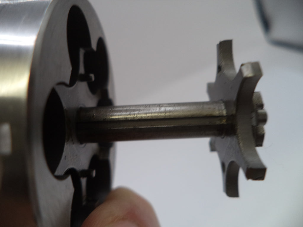 Close-up of a mechanical component with gears on a white background