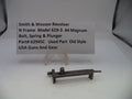 Gun part with a label on a white background