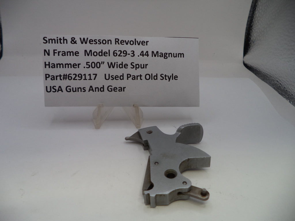 Smith & Wesson revolver part on a white background with a descriptive card.