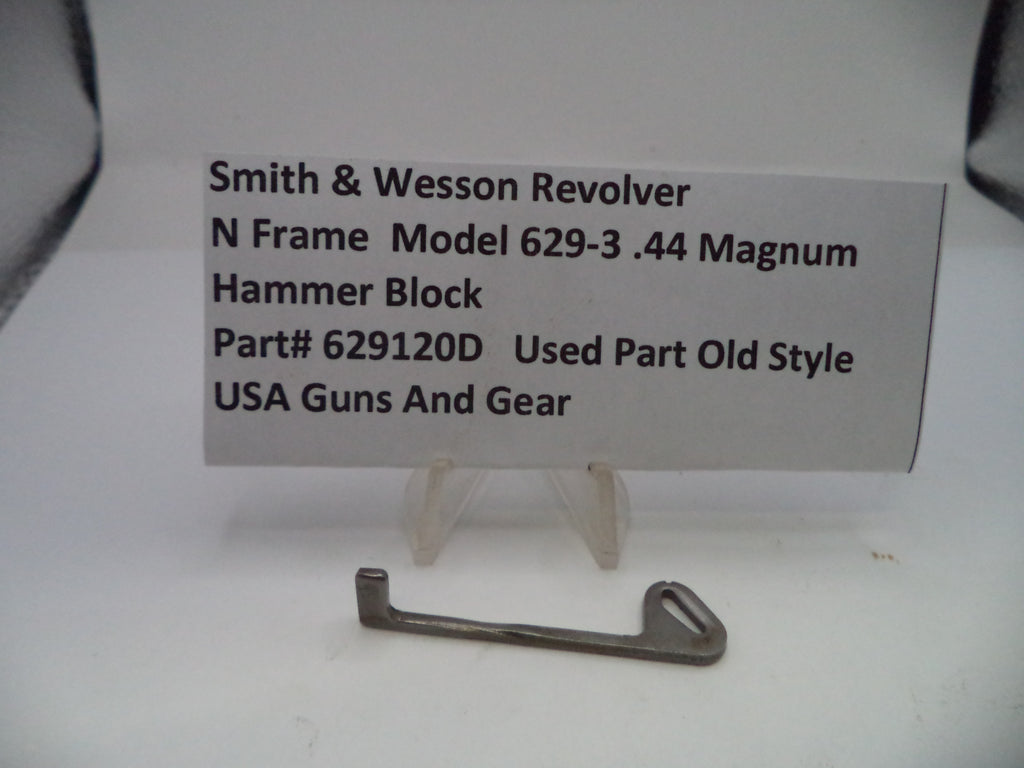 Smith & Wesson revolver hammer block on a white background with a label.