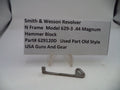 Smith & Wesson revolver hammer block on a white background with a label.