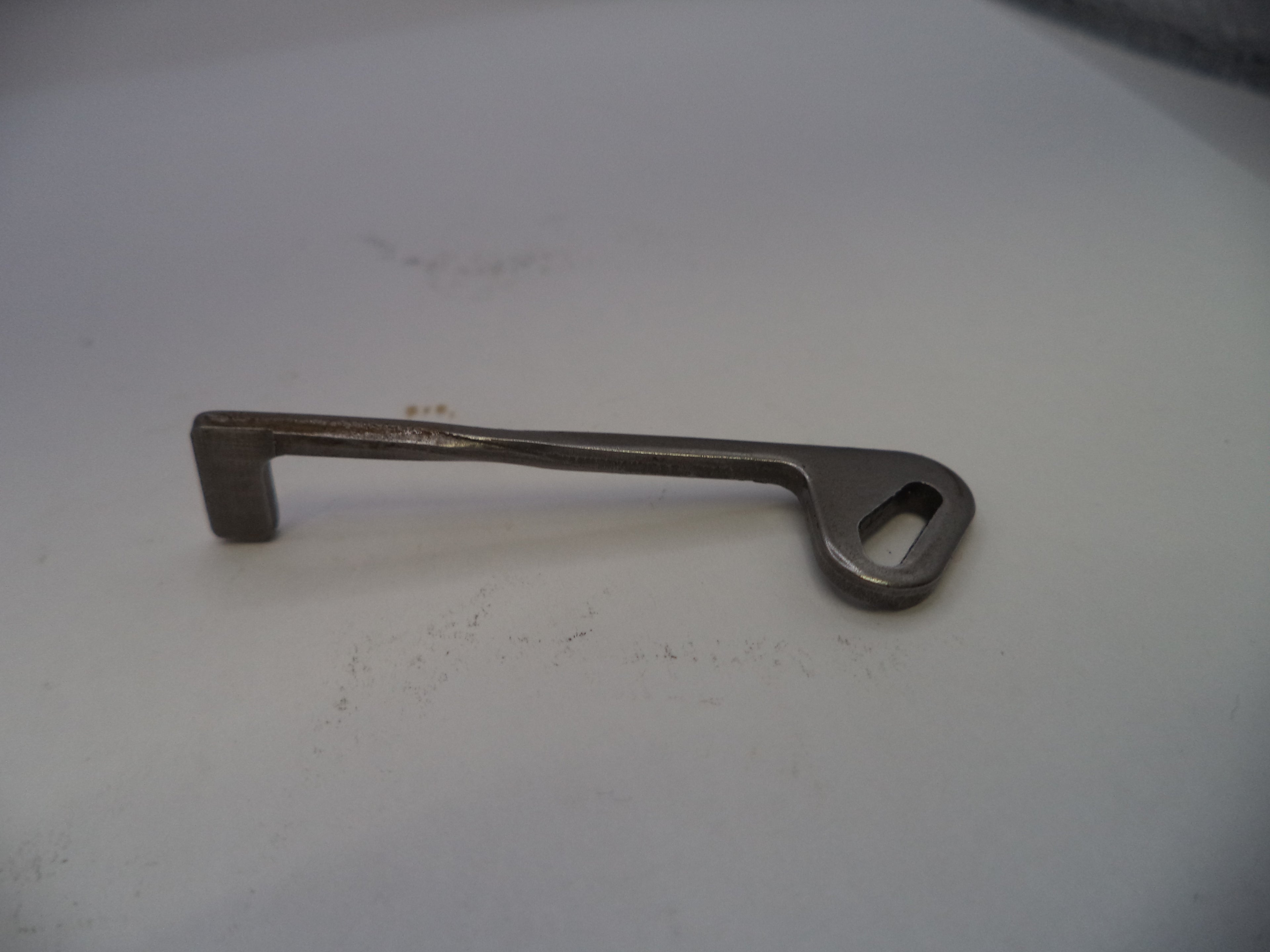 Metal key on a white surface
