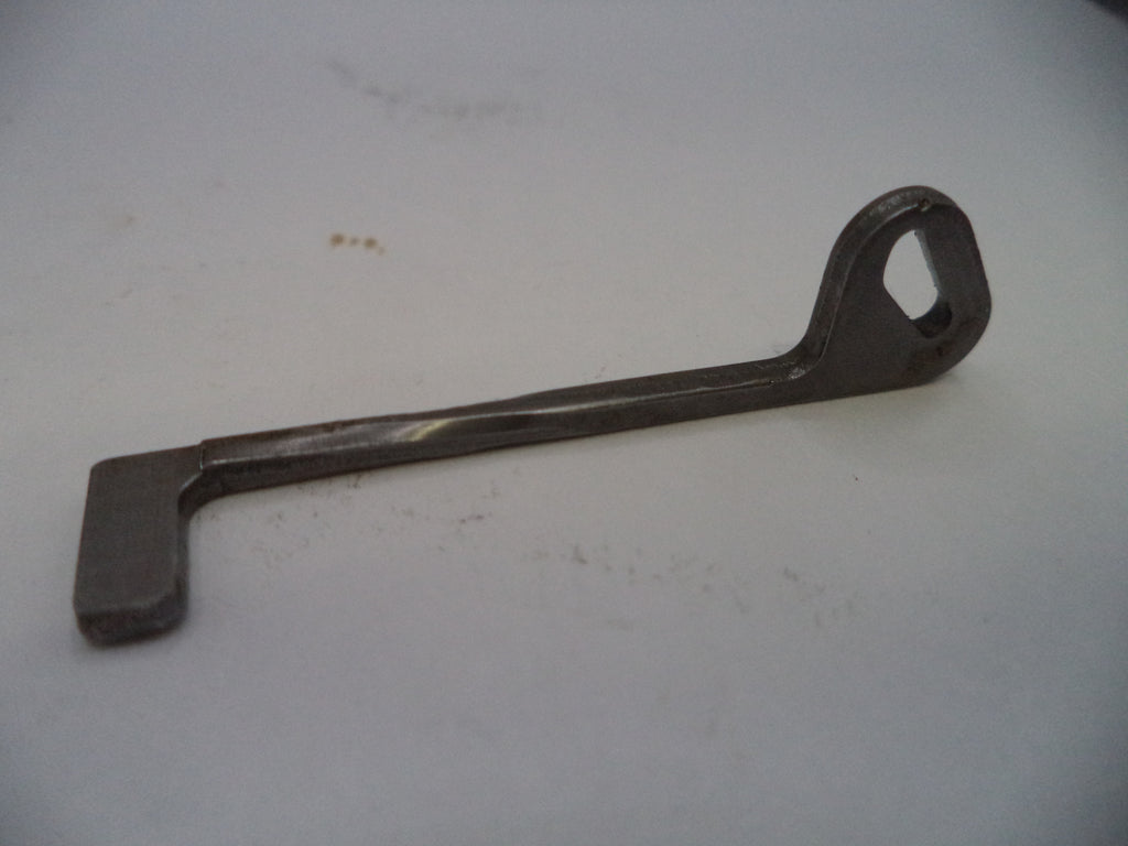 Metal wrench on a light gray background