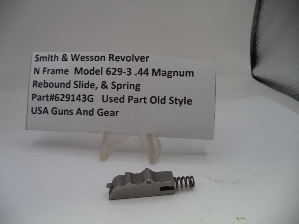 Smith & Wesson revolver part with descriptive card on a white background