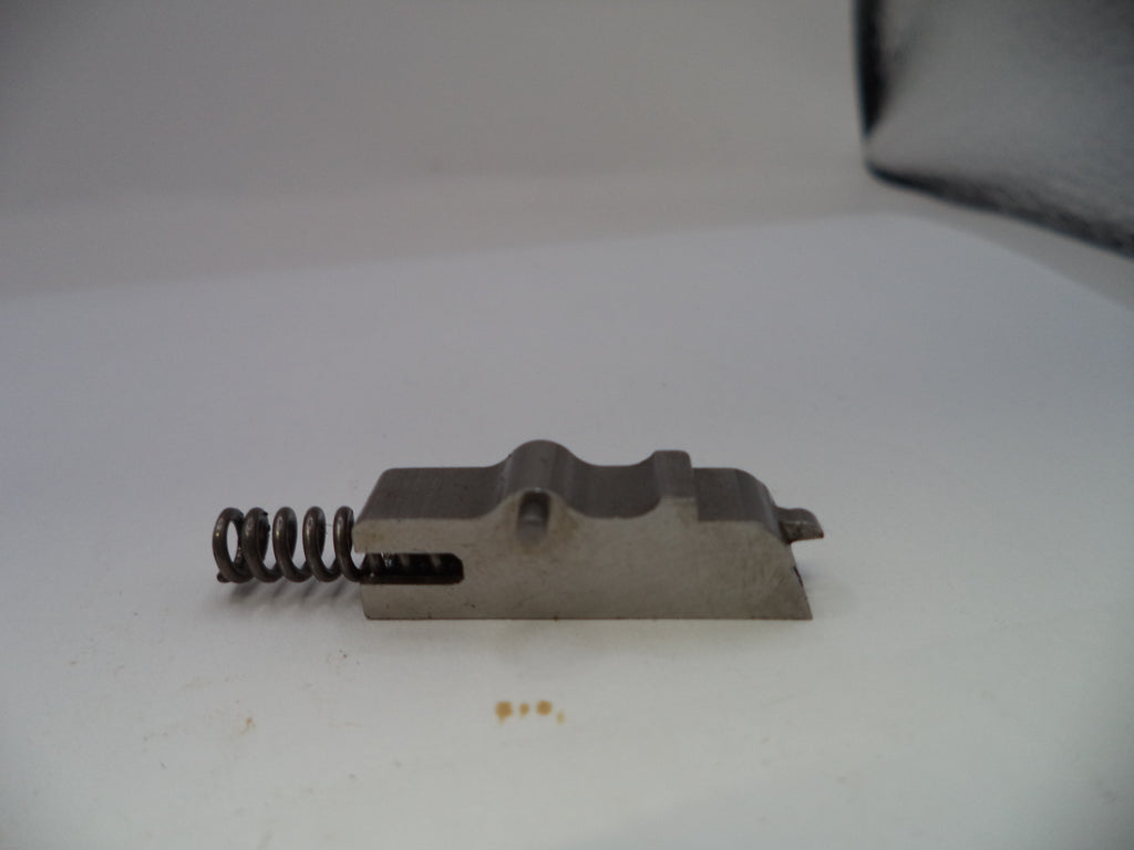 Metal component with a spring on a white background