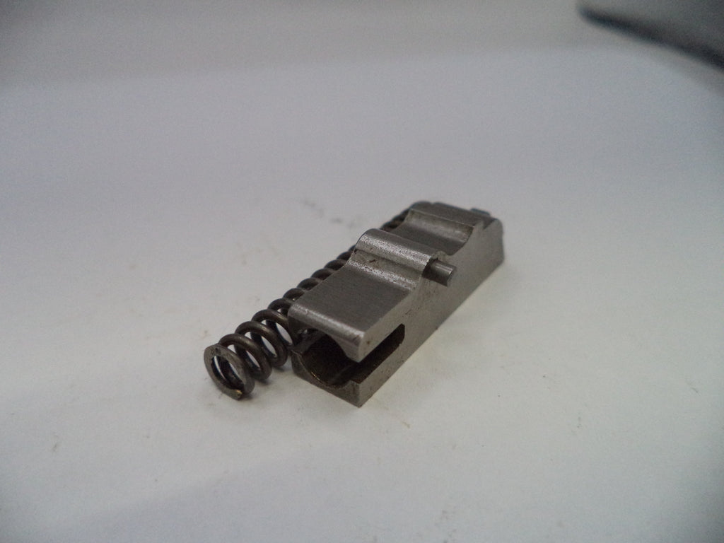 Metal component with a spring on a white background