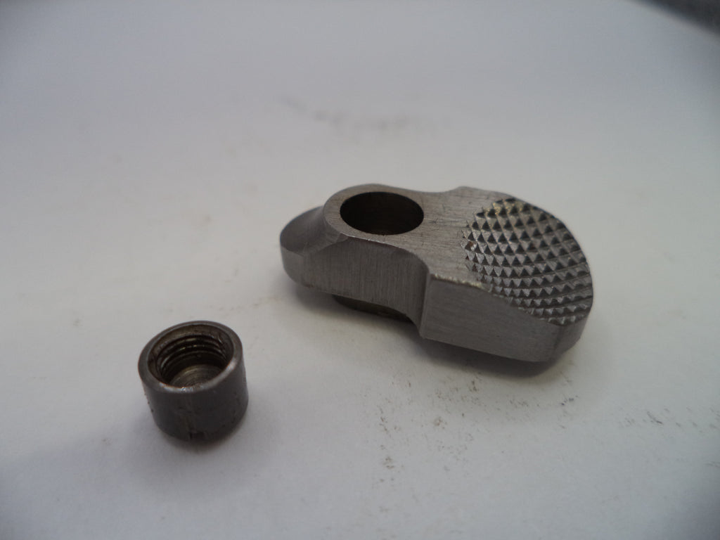 Two metal components on a white surface