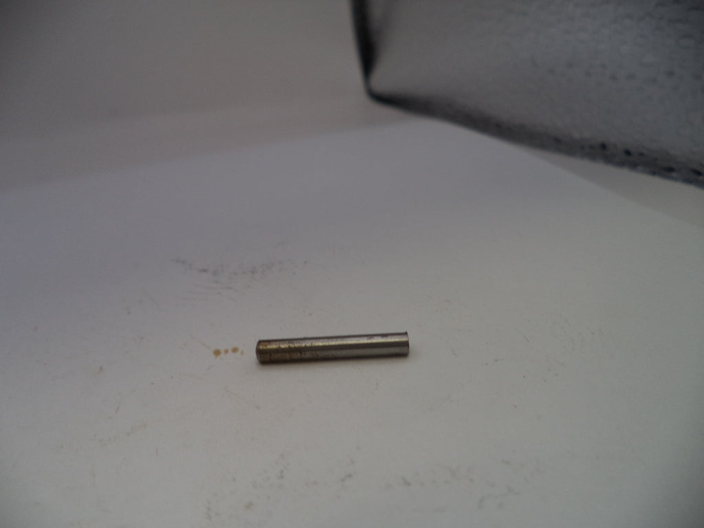 Small cylindrical metal object on a white surface