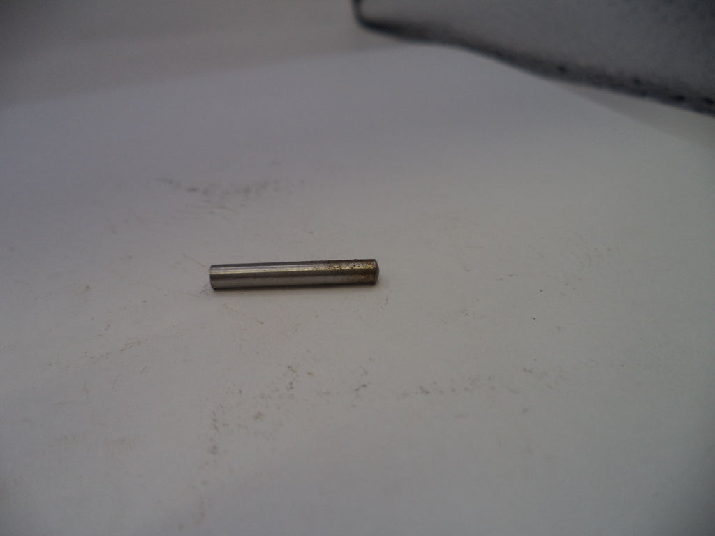 Small cylindrical metal object on a white surface