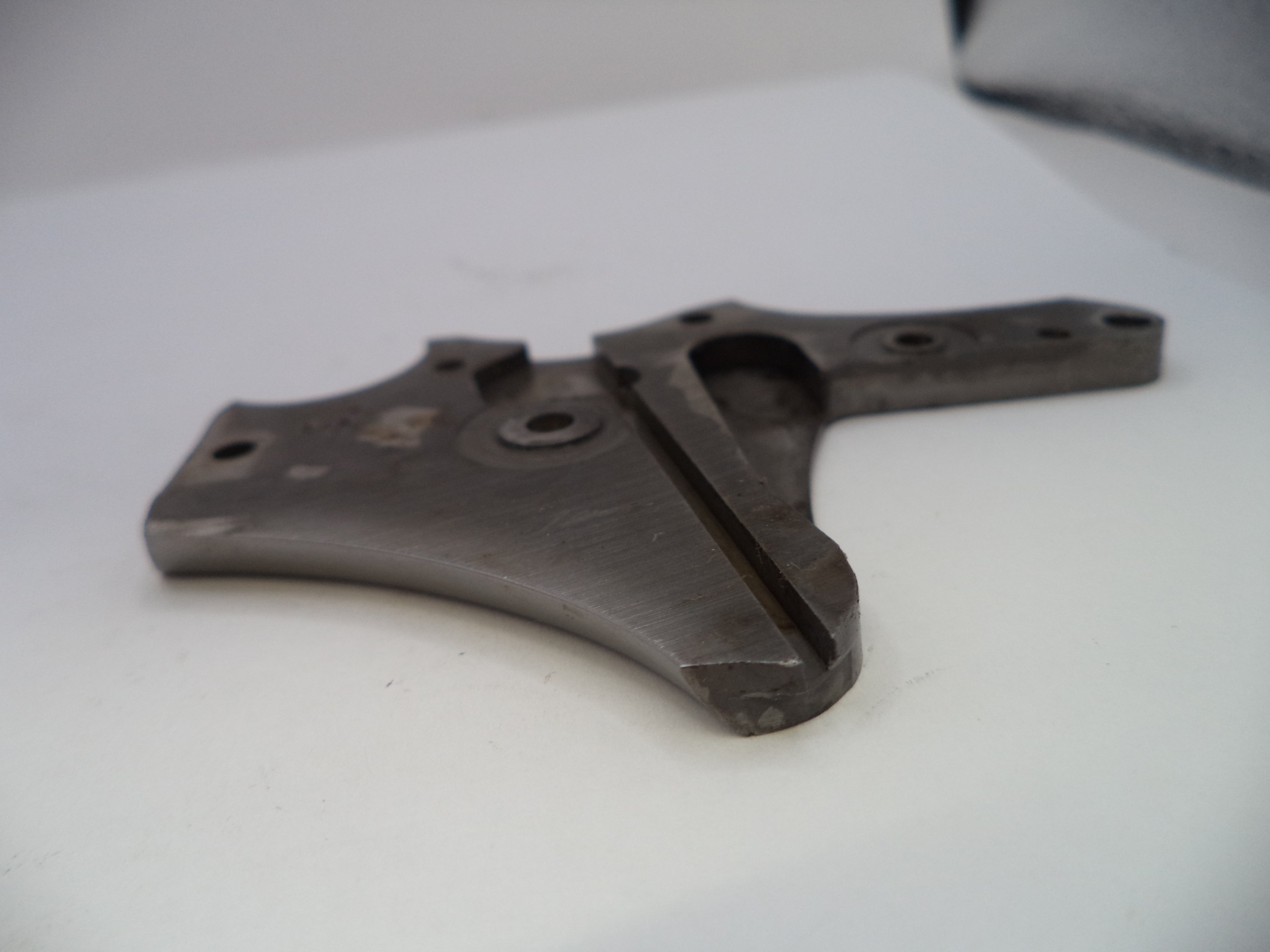 Metal mechanical component on a white surface