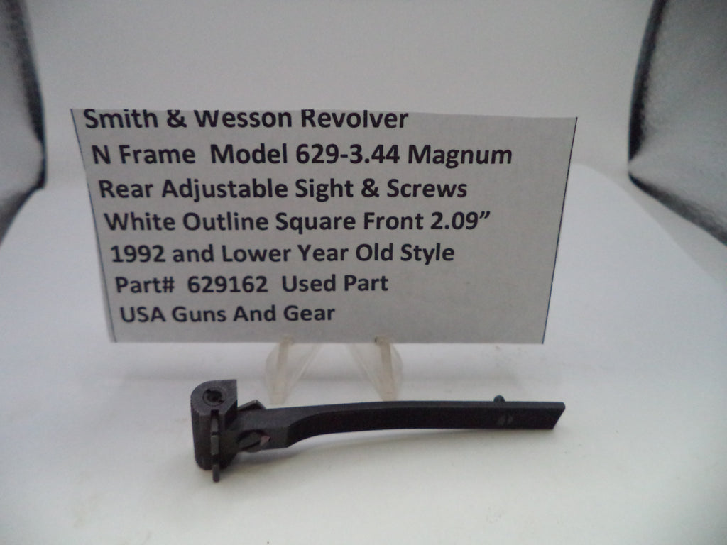 Smith & Wesson revolver part with descriptive card on a white background