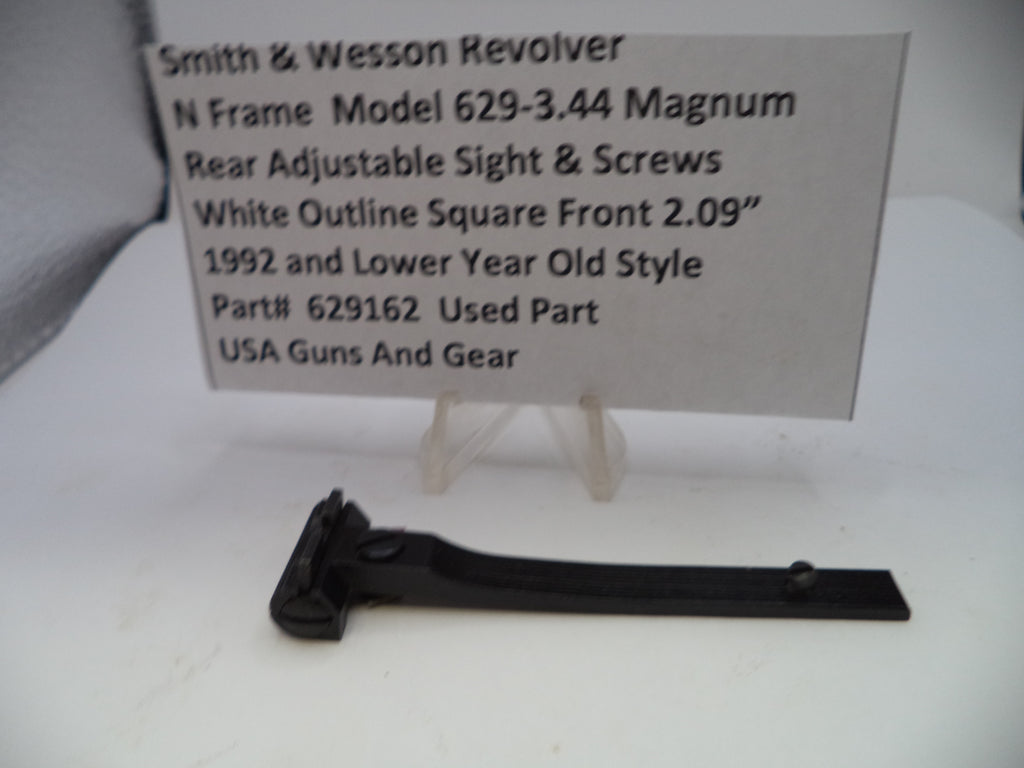 Smith & Wesson revolver part with descriptive card on a white background