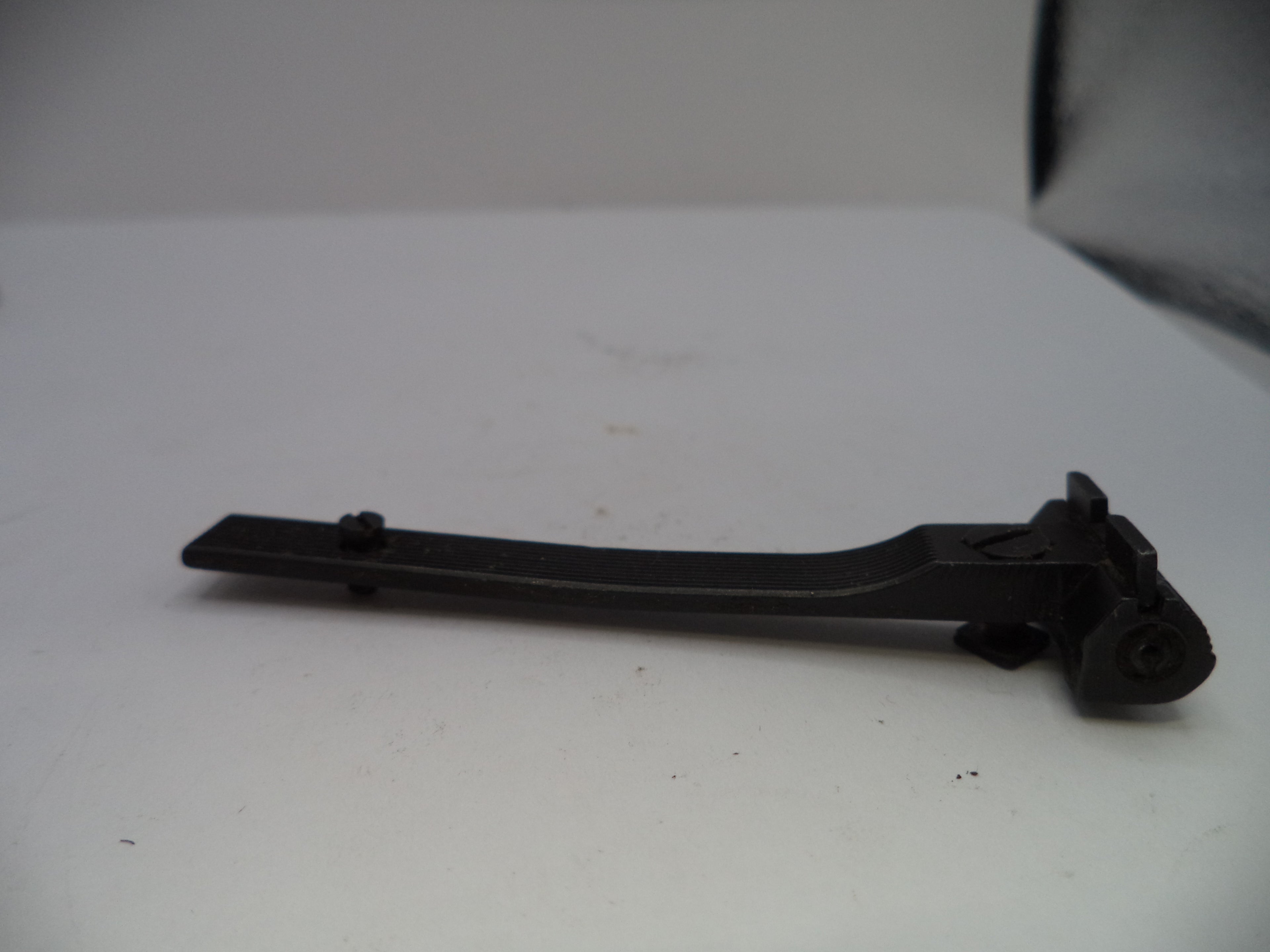 Black metal tool on a white surface