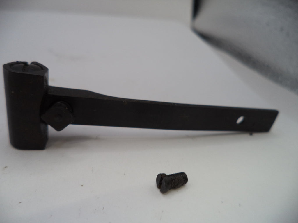 Black rubber mallet and screw on a white surface