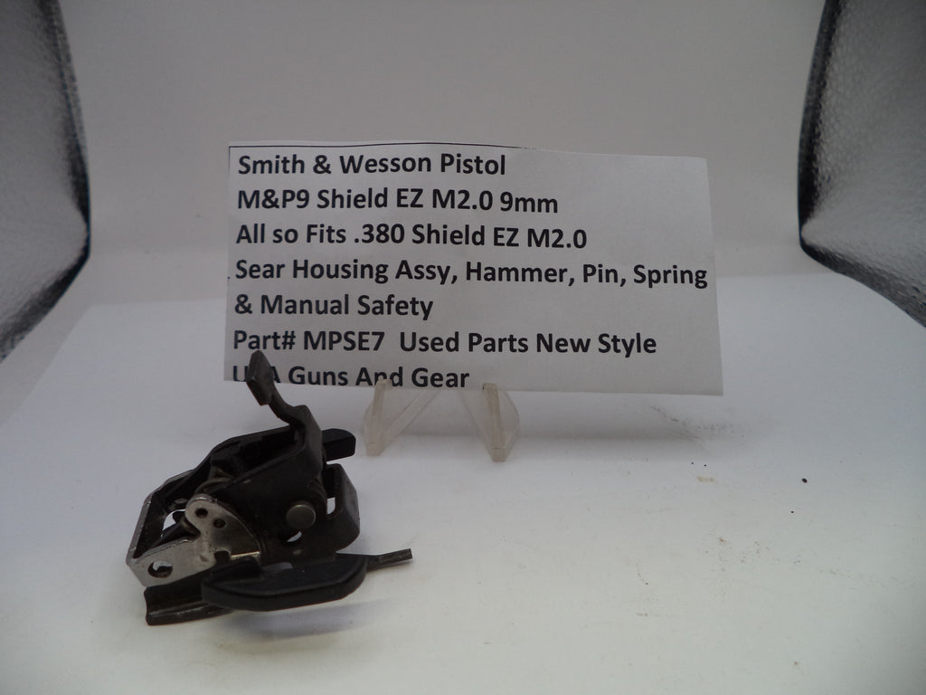 Smith & Wesson pistol part on a white background with a label