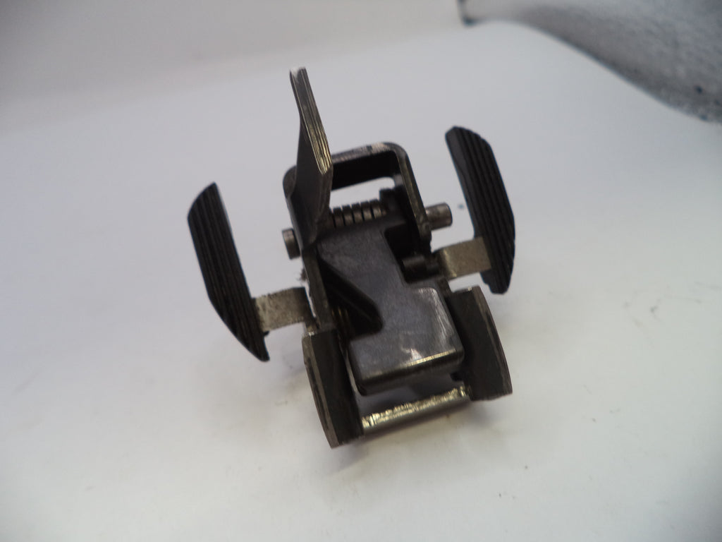 Metal clip or fastener on a white surface