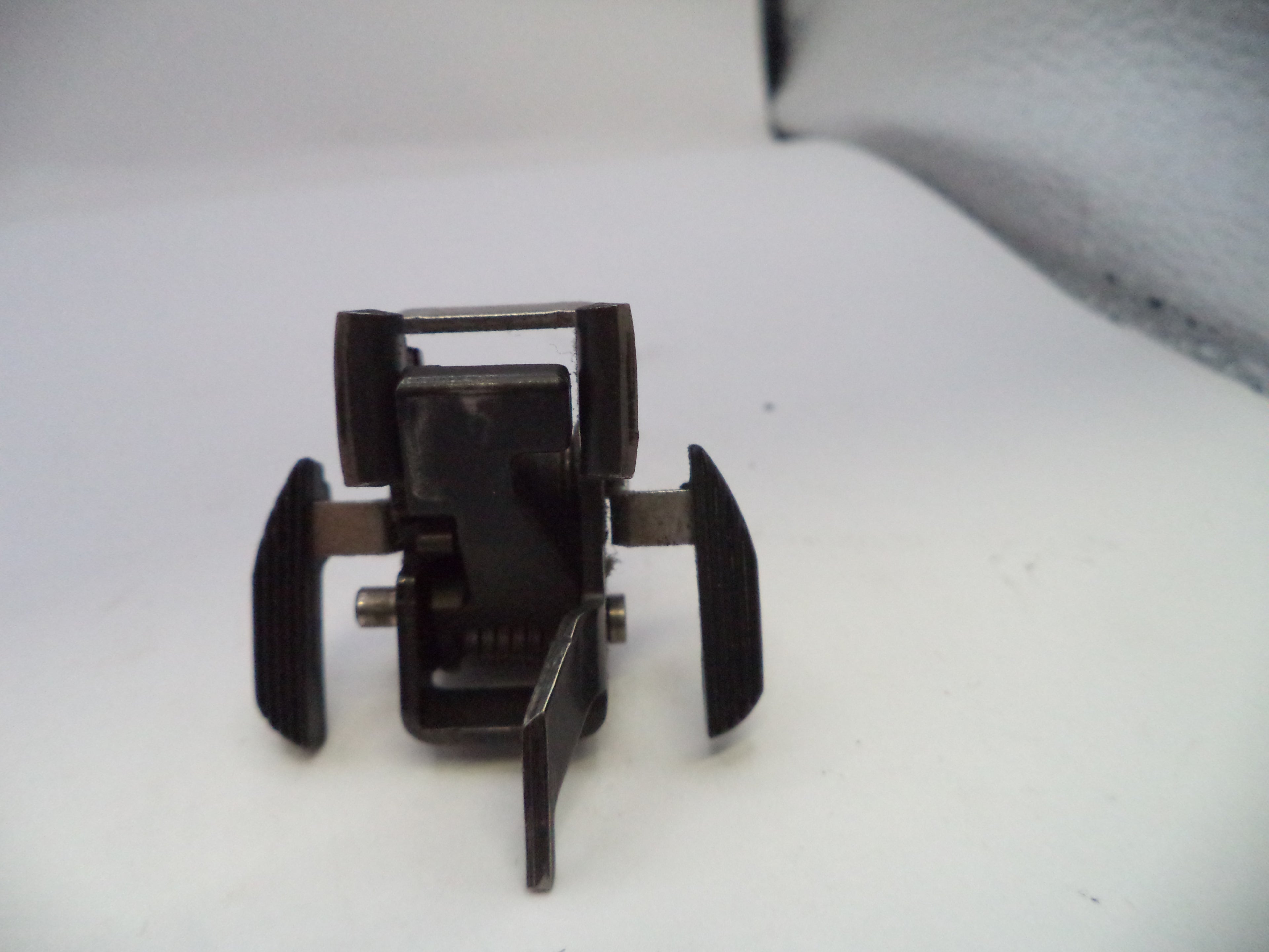 Metal clip or fastener on a white background