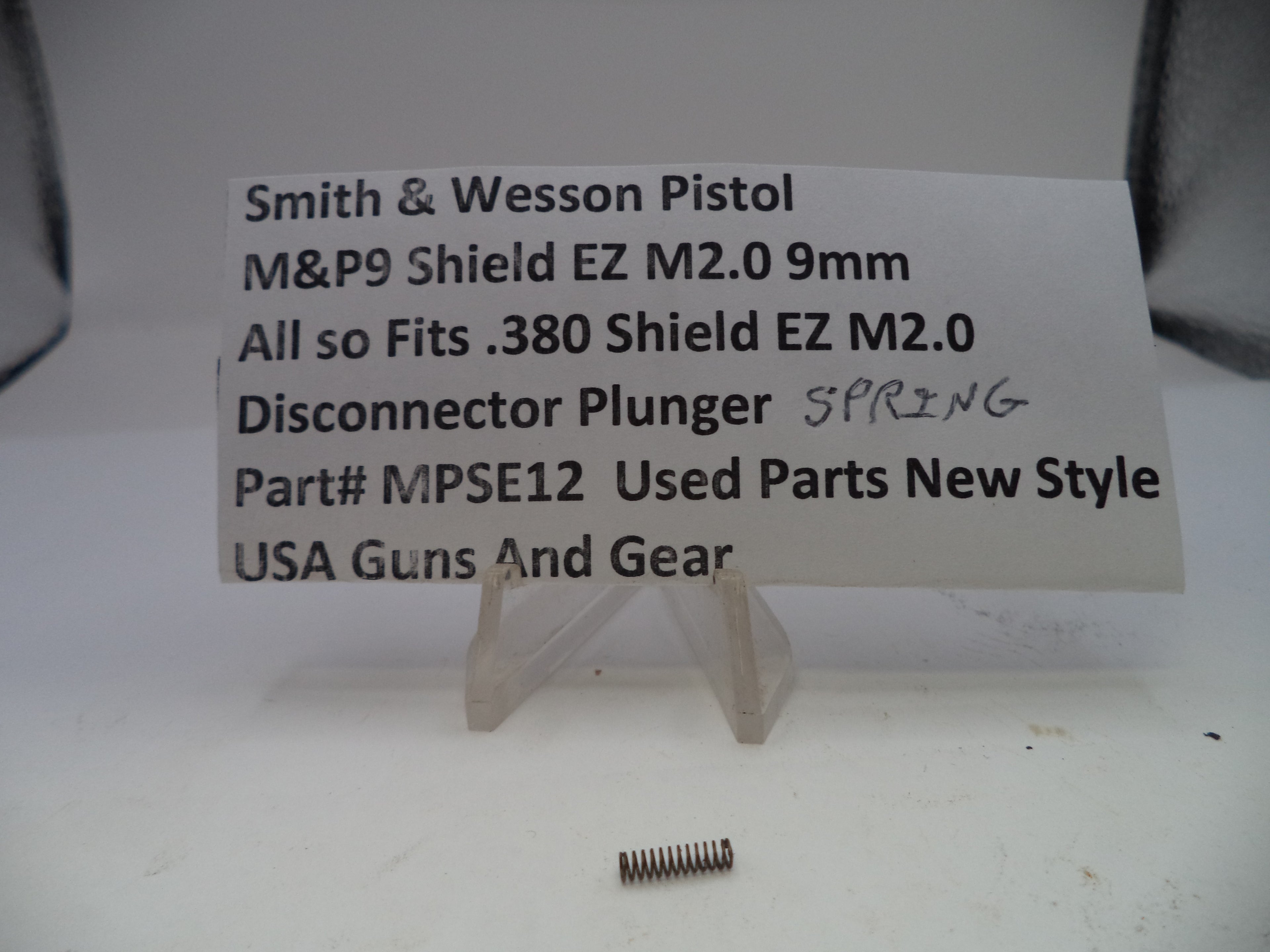 Spring for Smith & Wesson pistol on a card with product details