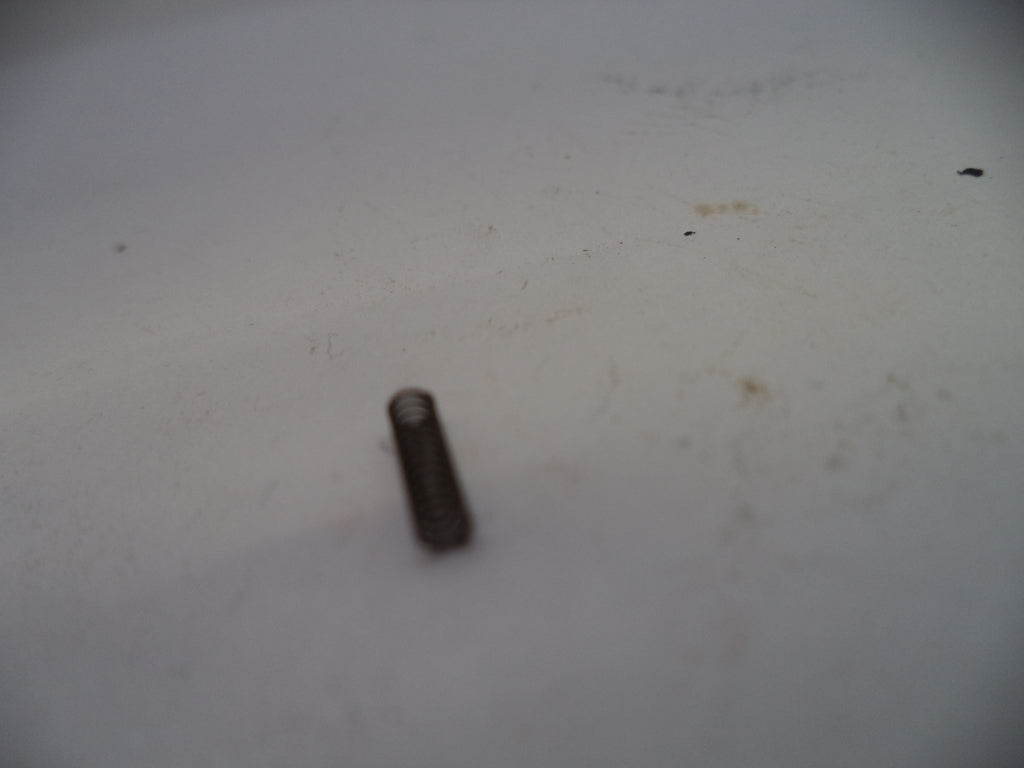 Small cylindrical object on a textured white surface