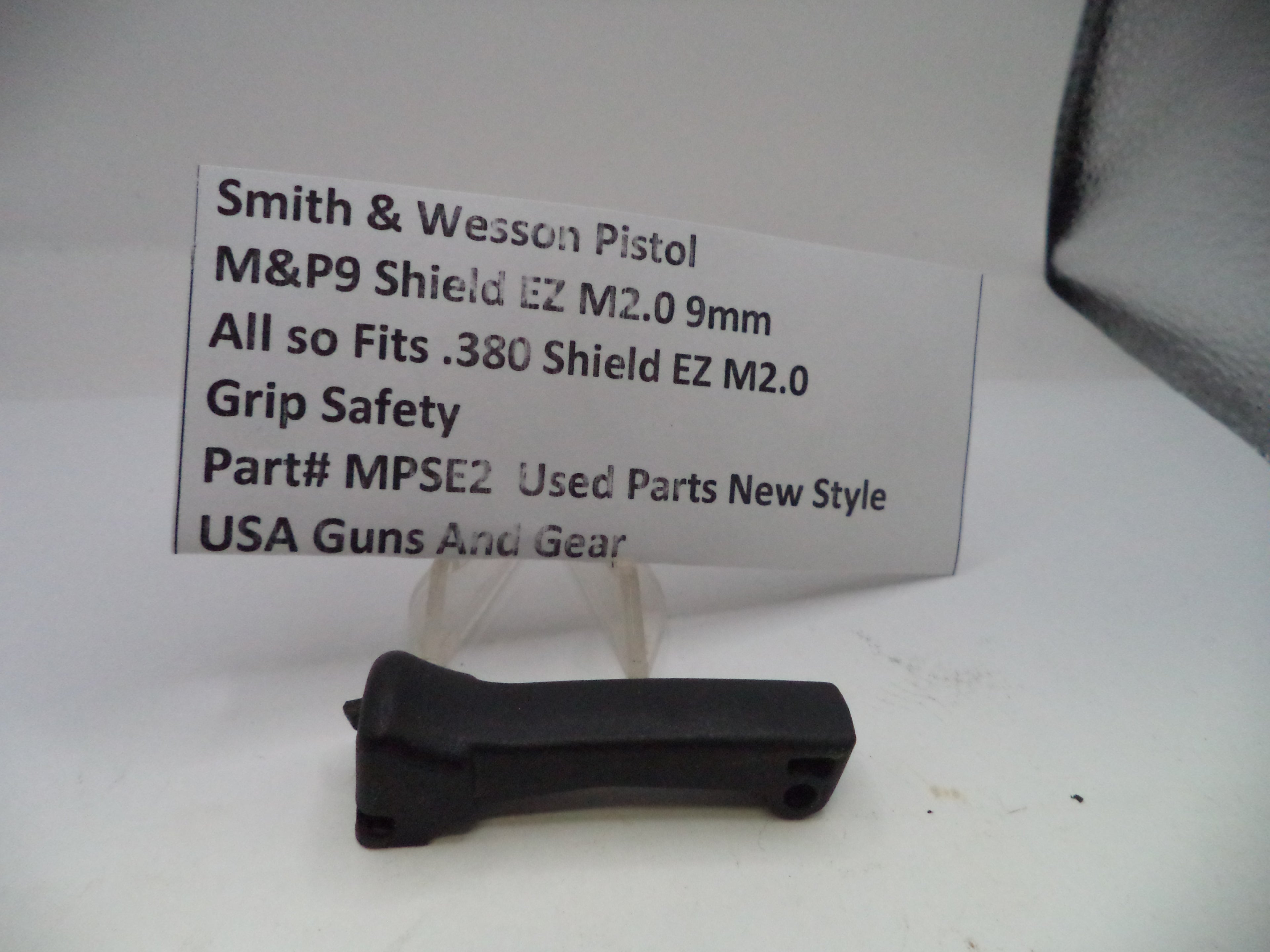 Black grip safety for Smith & Wesson M&P9 Shield EZ M2.0 9mm pistol on a white background with a label.