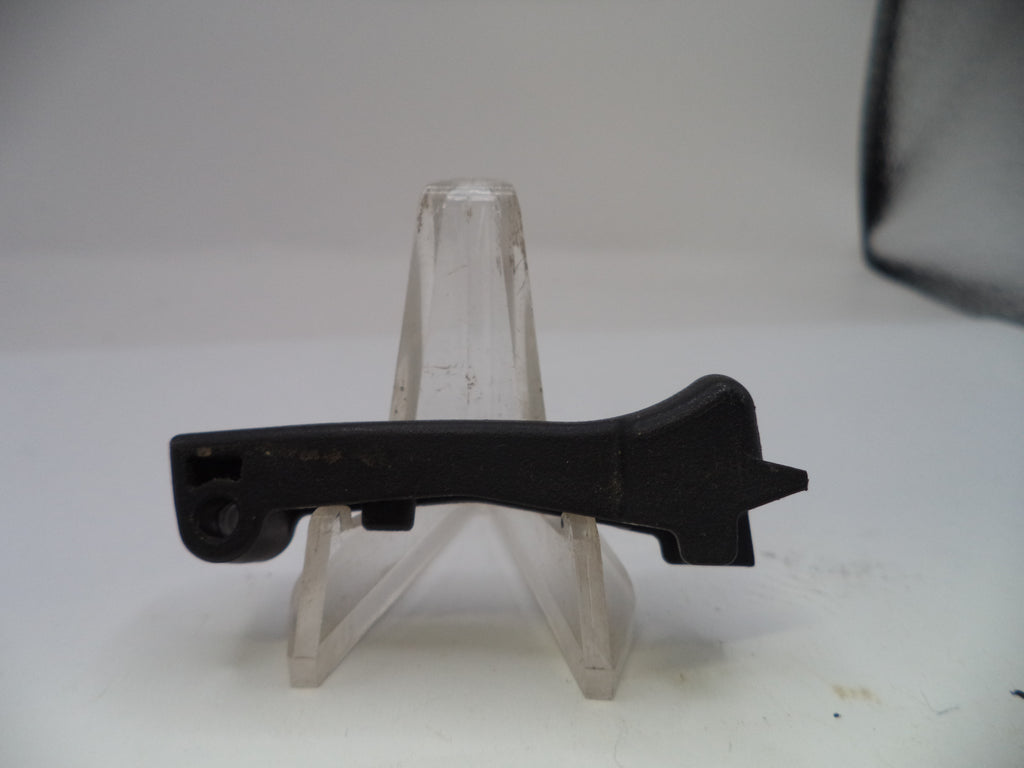 Black metal bracket on a clear stand against a white background