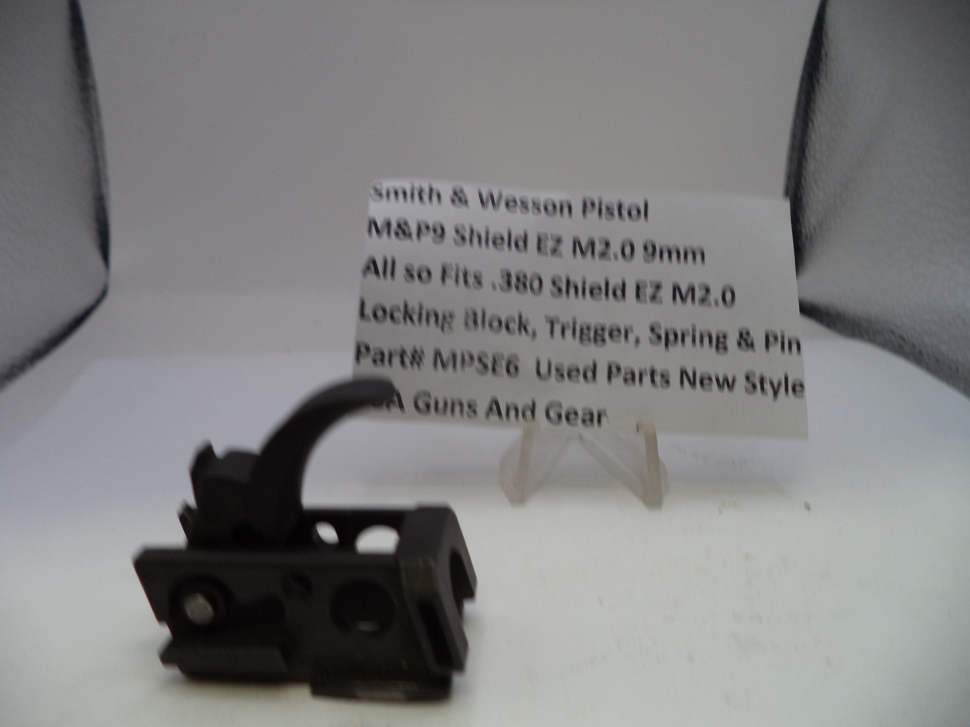 Black gun part on a white background with text about Smith & Wesson Pistol M&P9 Shield EZ.