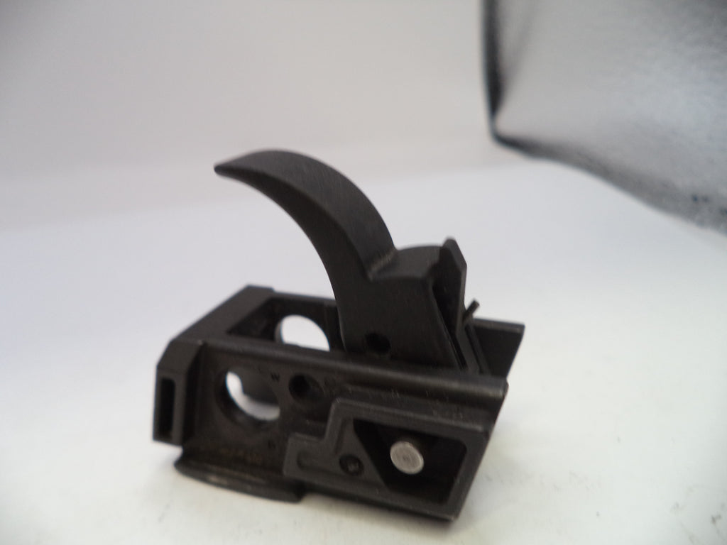 Black plastic component on a white background