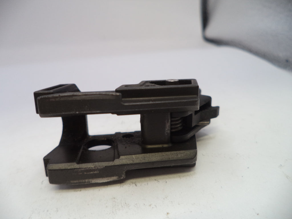 Black metal bracket on a white surface