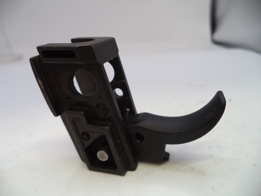 Black plastic component on a white background