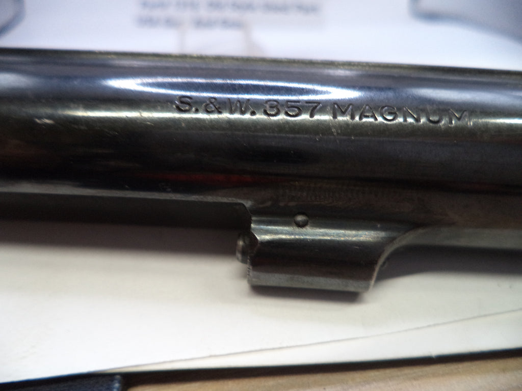 Close-up of a S&W 686 Magnum firearm slide on a white background