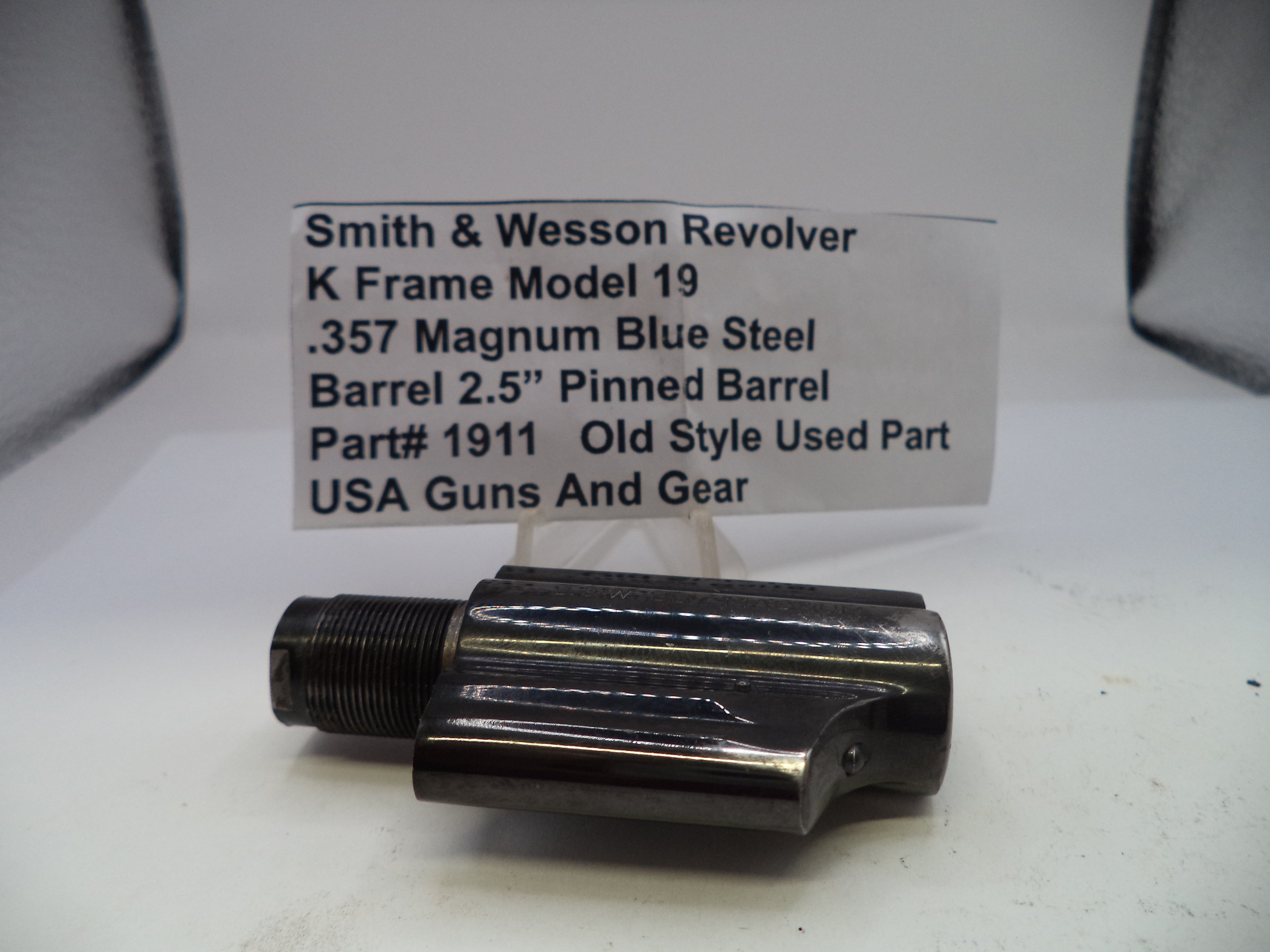 Smith & Wesson revolver barrel on a white background with descriptive text card.