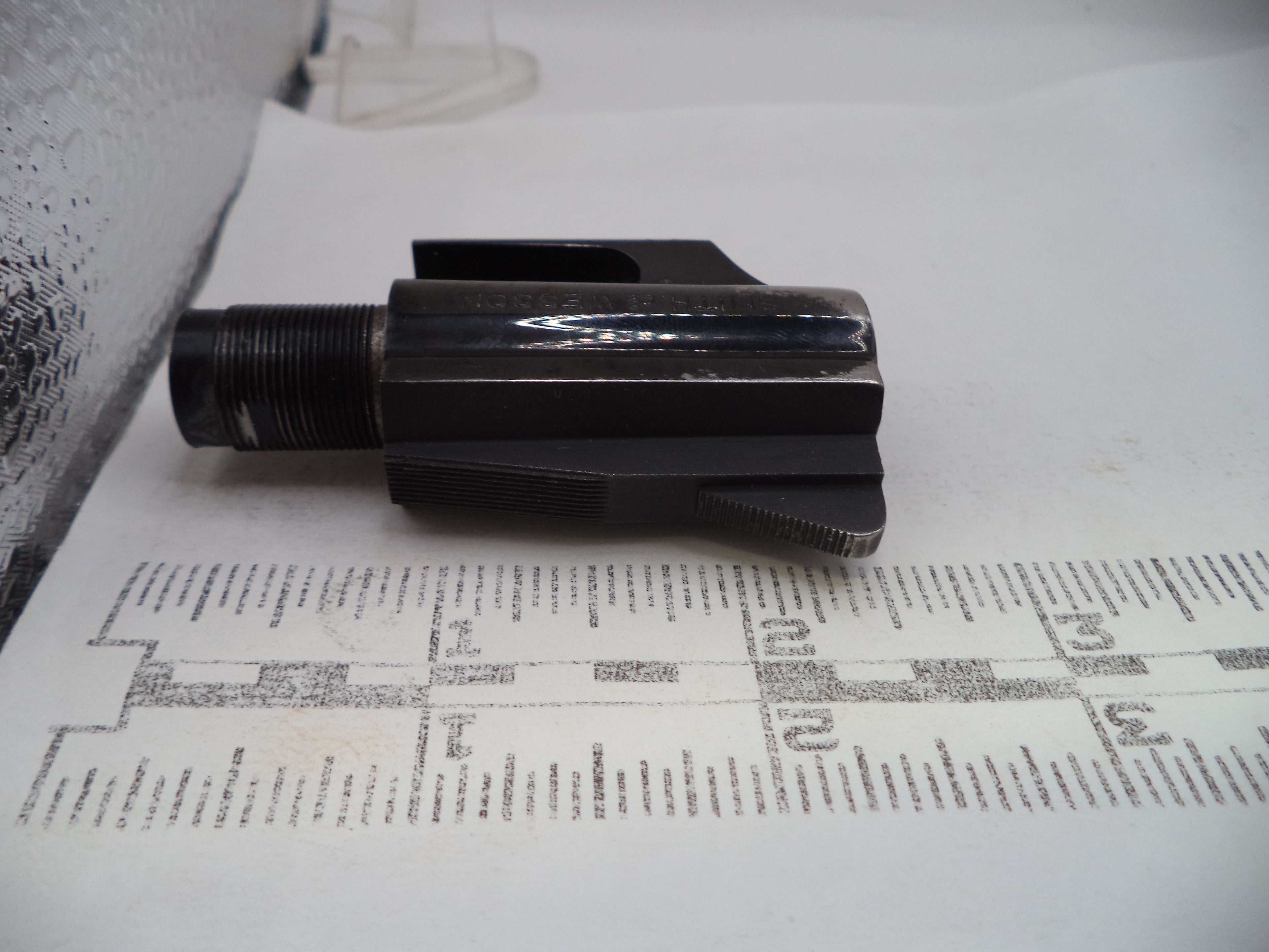 Black metal component on a printed document