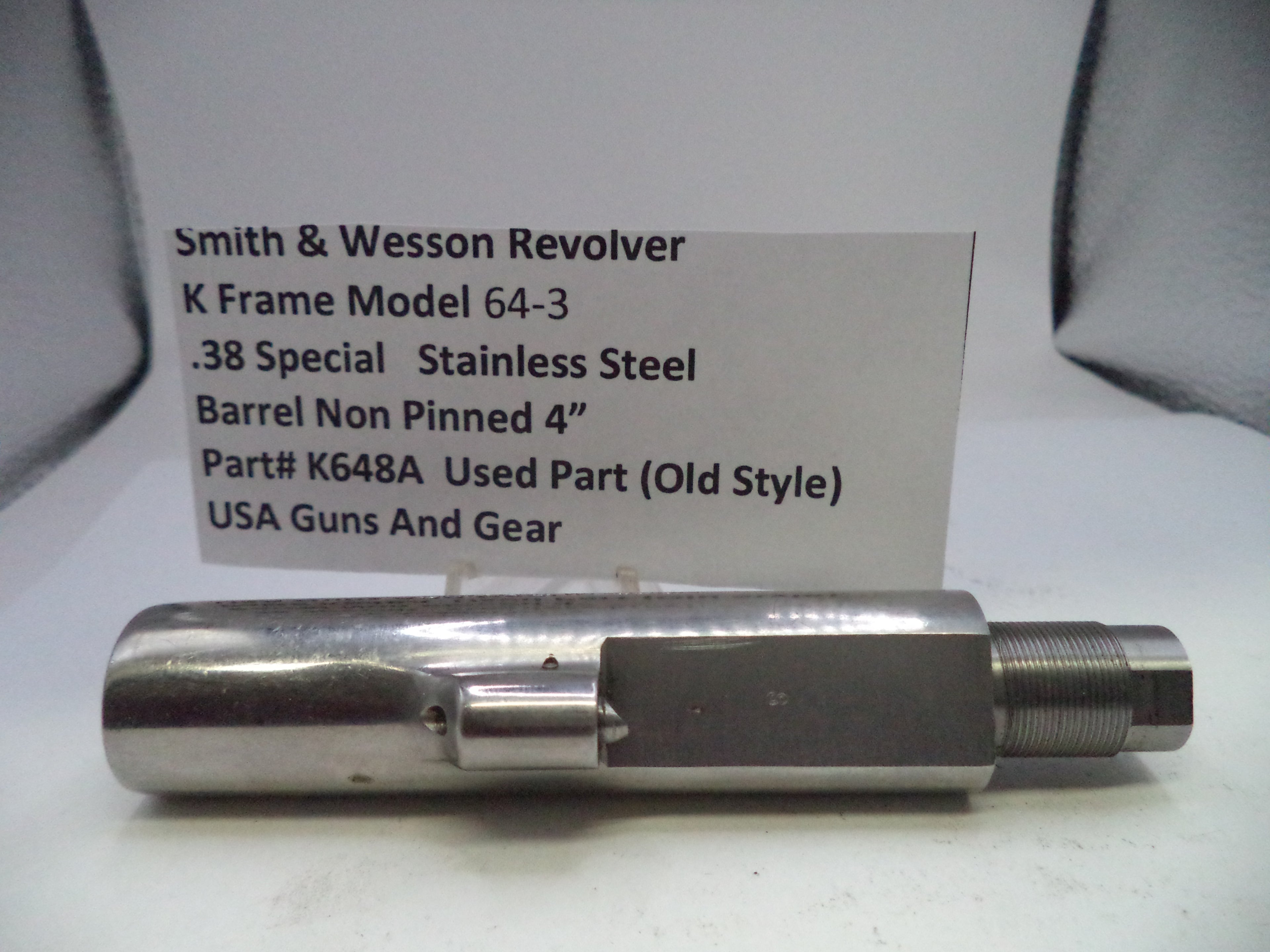 Smith & Wesson revolver barrel on a white background with descriptive text card.