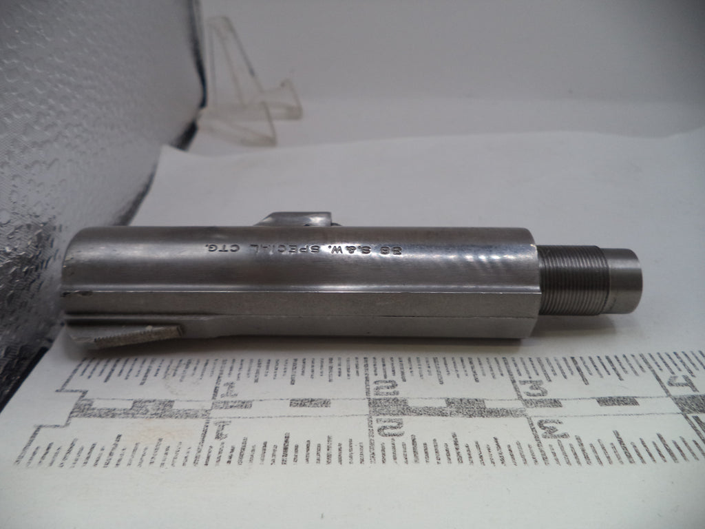 Metal cylindrical object on a printed paper background