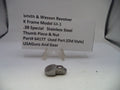 Smith & Wesson revolver part on a white background with descriptive text card.