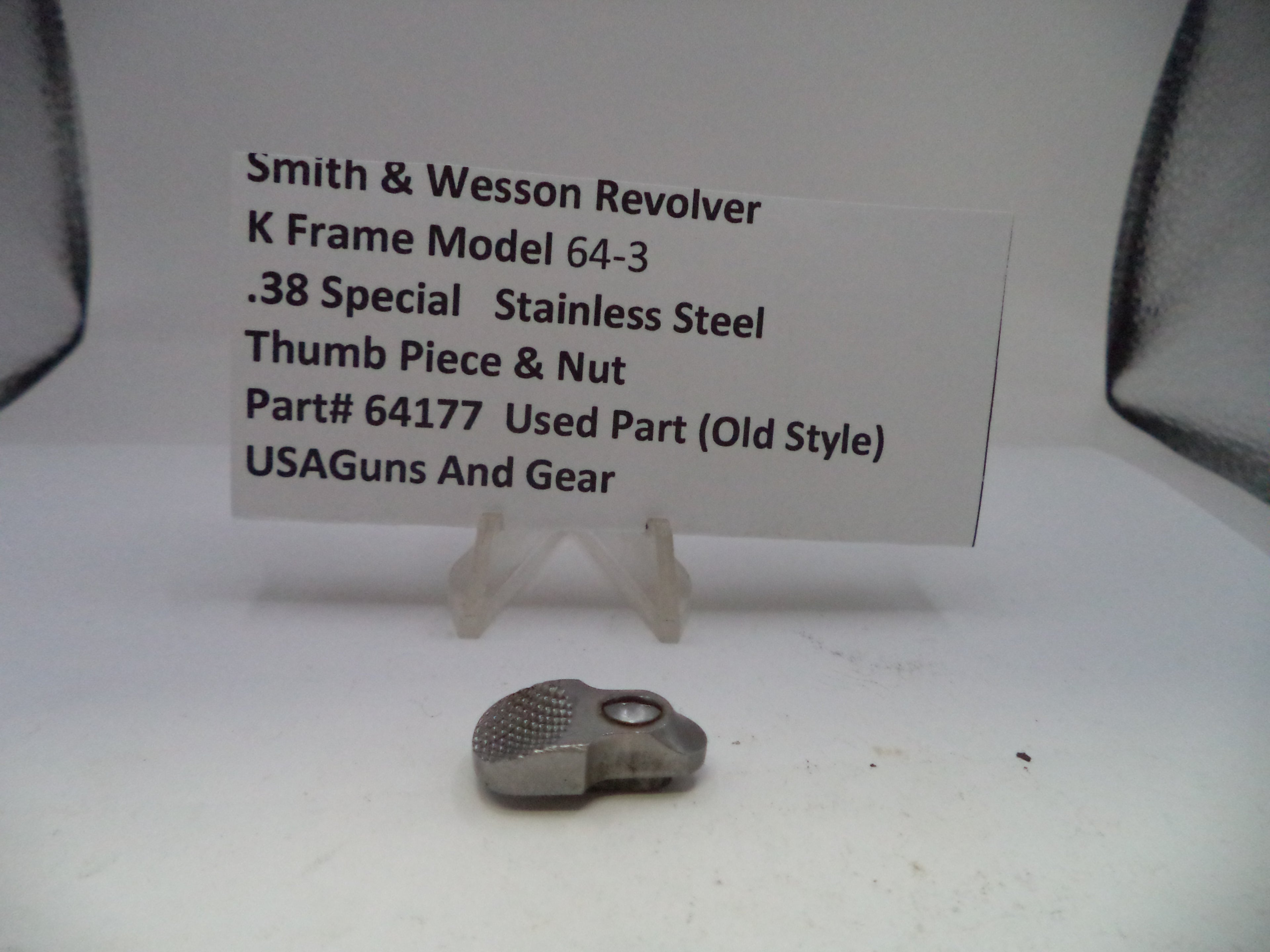 Smith & Wesson revolver part on a white background with descriptive text card.