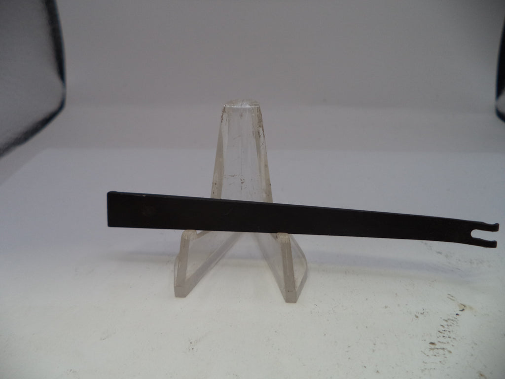 Metal tool on a stand against a white background