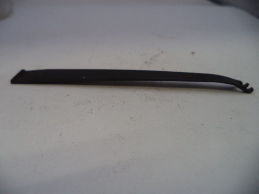 Black rubber strip on a white surface