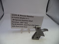 Smith & Wesson revolver part with descriptive card on a white background