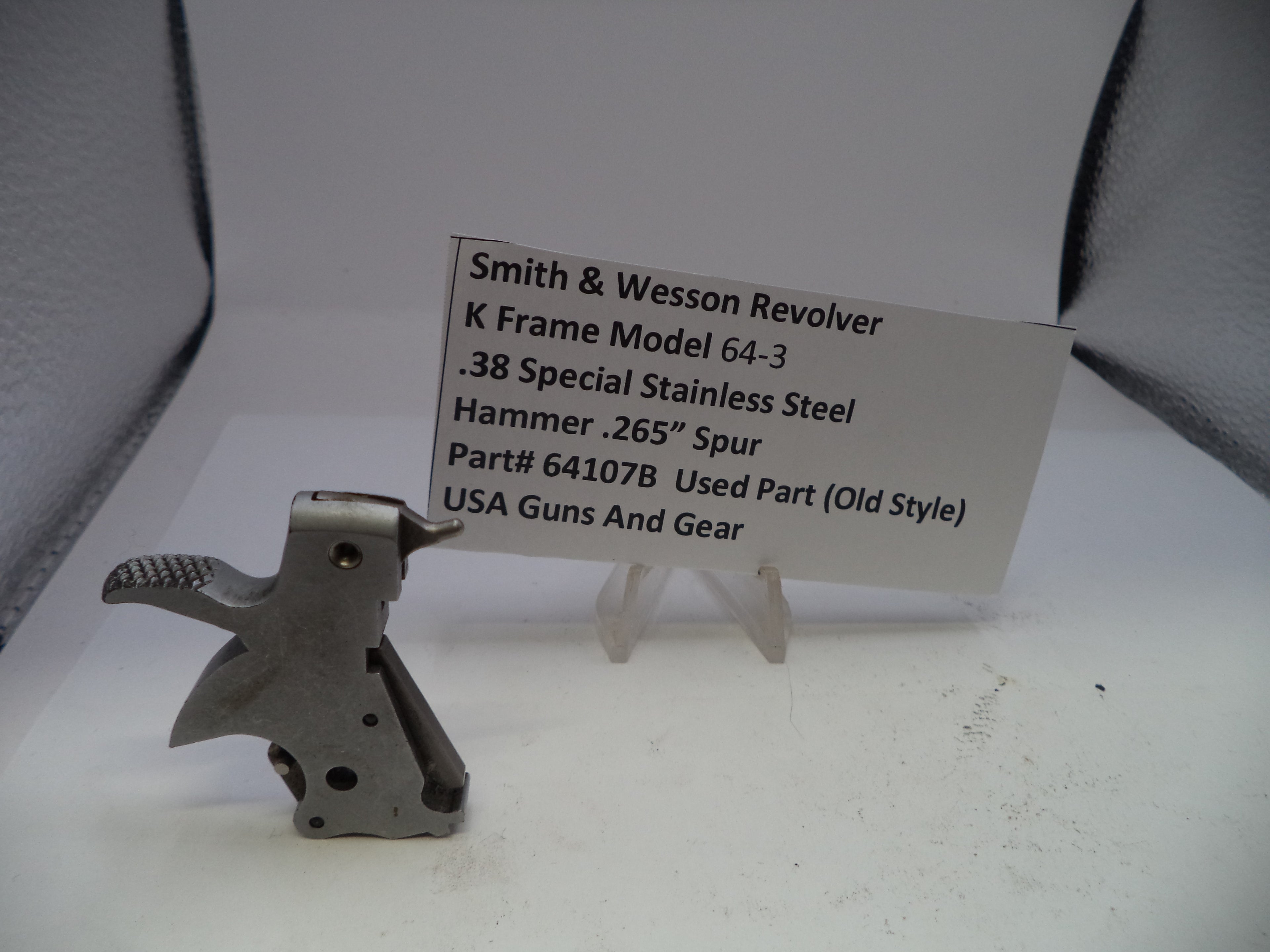 Smith & Wesson revolver part on a white background with a label