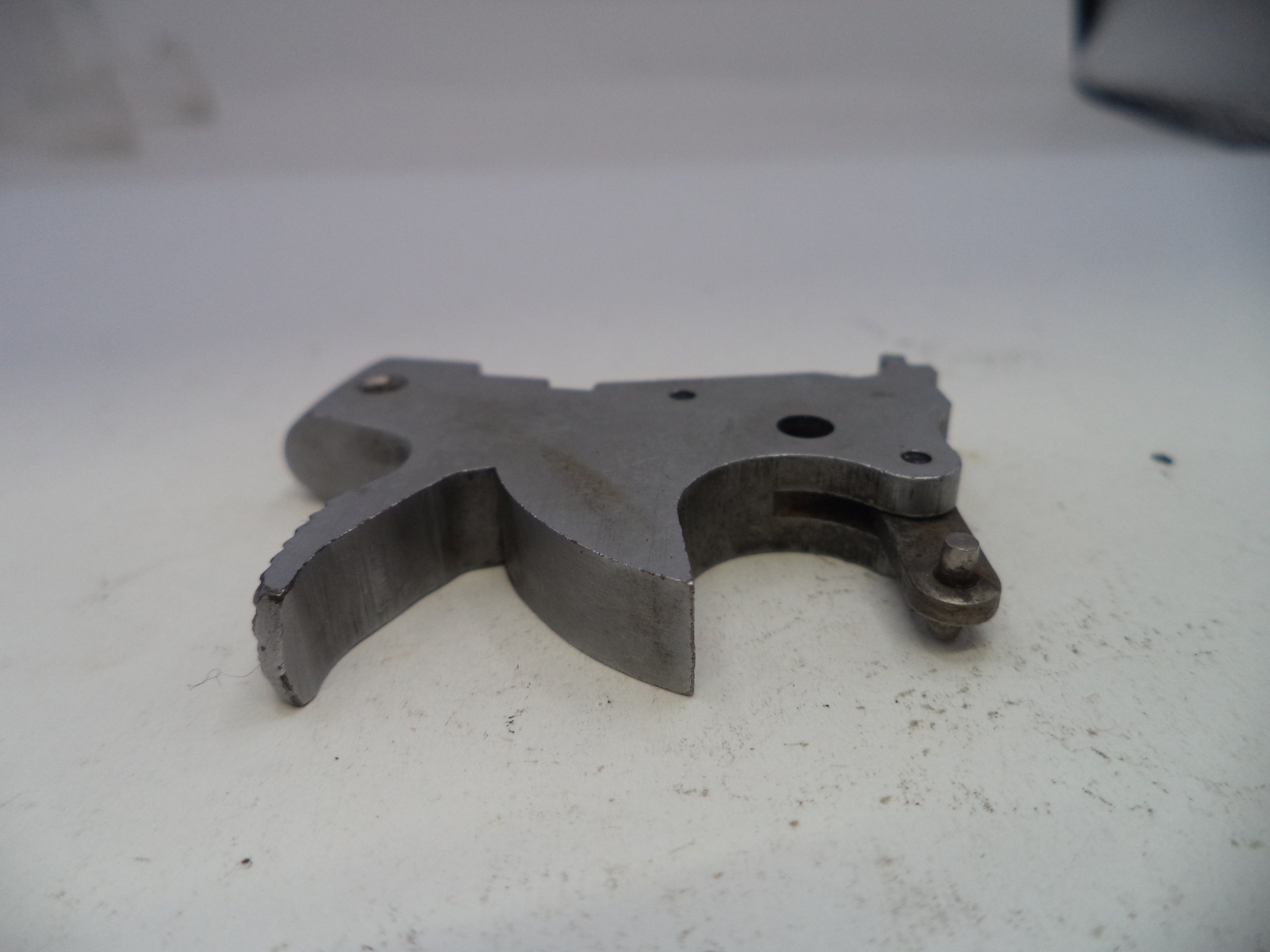 Metal mechanical component on a white surface